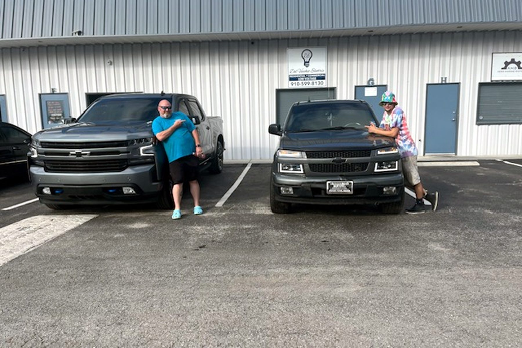 Two detailed trucks ready for pickup at the lot — car lot cleaning Wilmington NC, dealership detailing