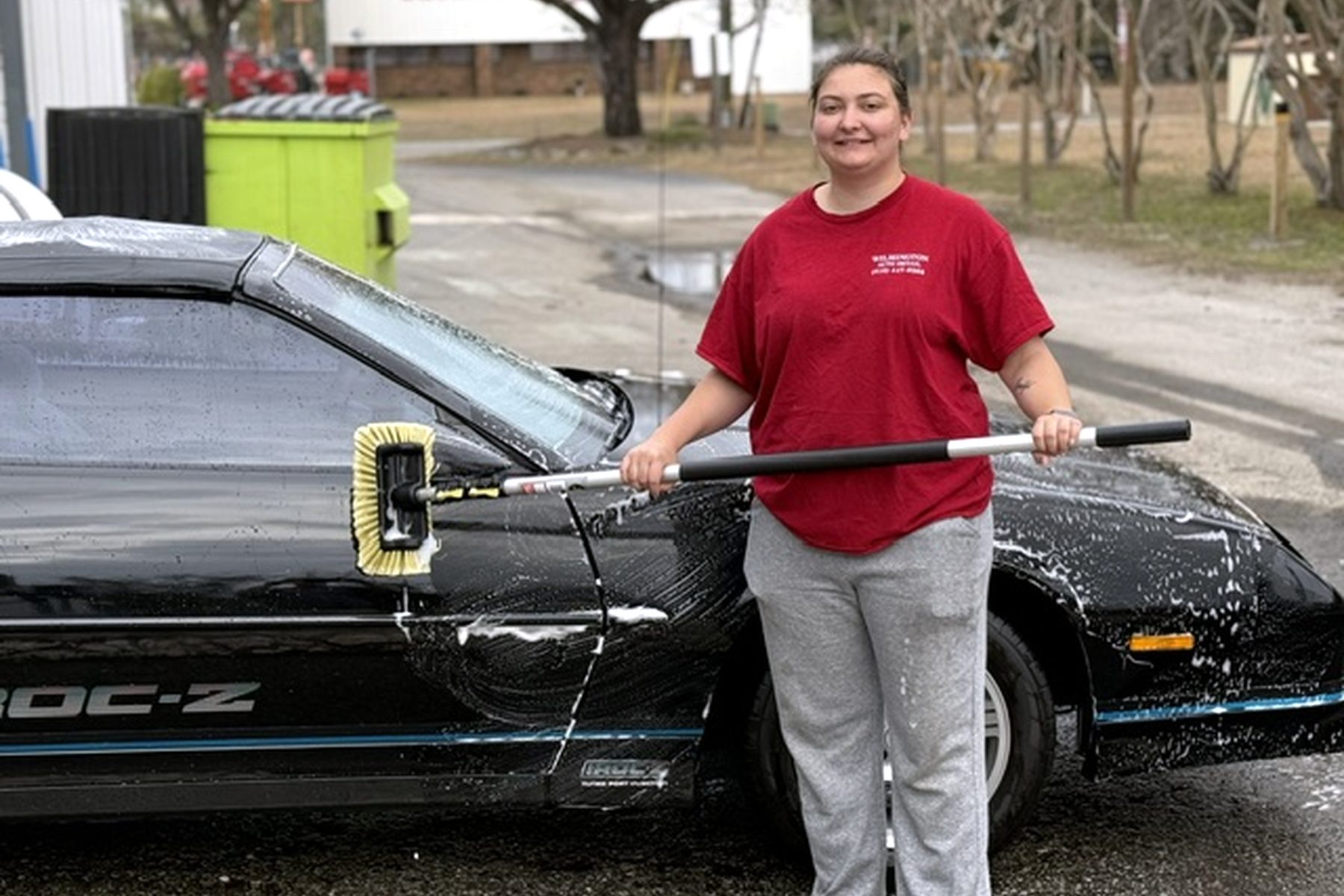 Wilmington Auto Detail team member foam-washing a customer's car on site — mobile car wash Wilmington NC