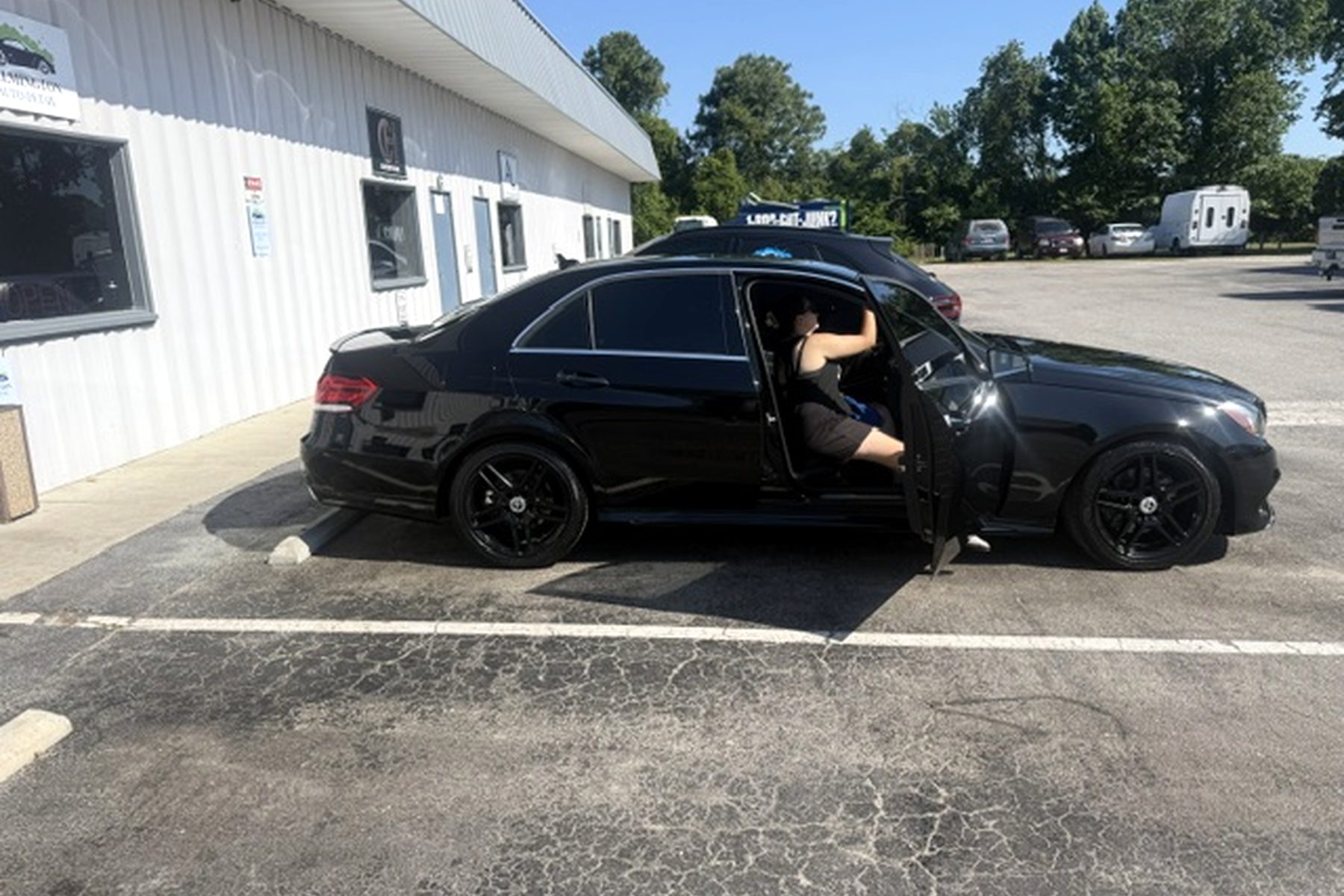 Black Mercedes-Benz being detailed at Wilmington Auto Detail — car odor removal and interior shampoo Wilmington NC